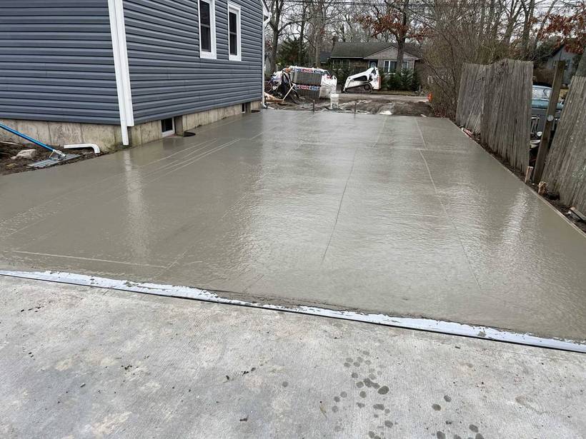 Freshly poured and finished concrete driveway