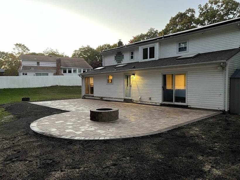 Curved paver patio with built-in fire pit