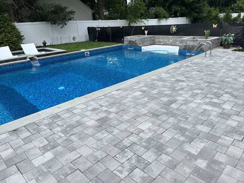 Pool deck with spa surround and raised planters